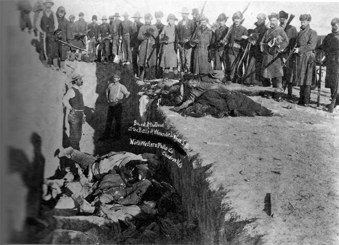 Burying the dead in a mass grave after the Wounded Knee Massacre