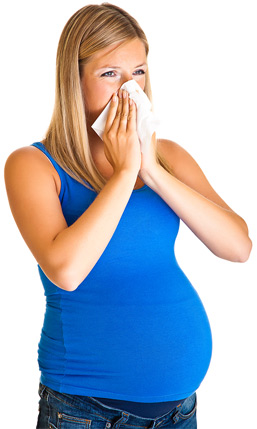 pregnant woman with cold blowing nose